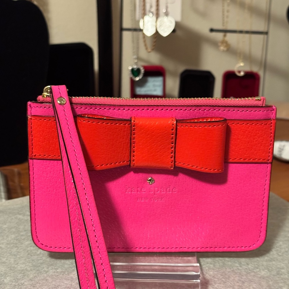 Kate Spade Pink with  Orange bow Wristlet EC